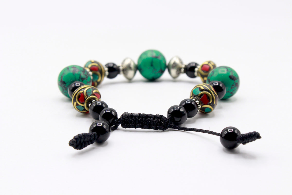 Black Onyx and Turquoise bead bracelet showing the adjustable Cobra Knot closure.
