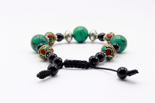 Black Onyx and Turquoise bead bracelet showing the adjustable Cobra Knot closure.