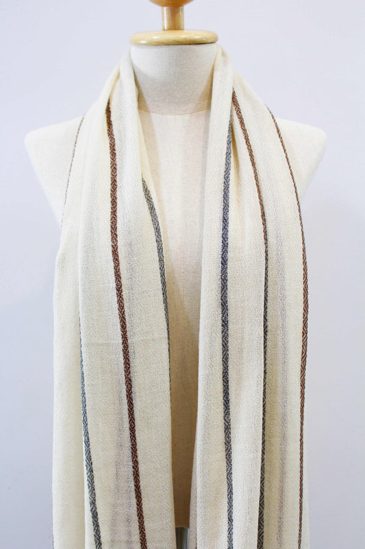 Women's 100% cashmere brown and gray striped beige scarf draped on a mannequin