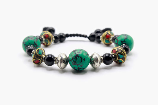 Black Onyx and Turquoise bead bracelet with Tibetan bead details, front view.