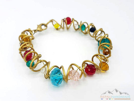 Multicolor faceted beads bracelet with gold-tone wire wrapping and clasp closure.