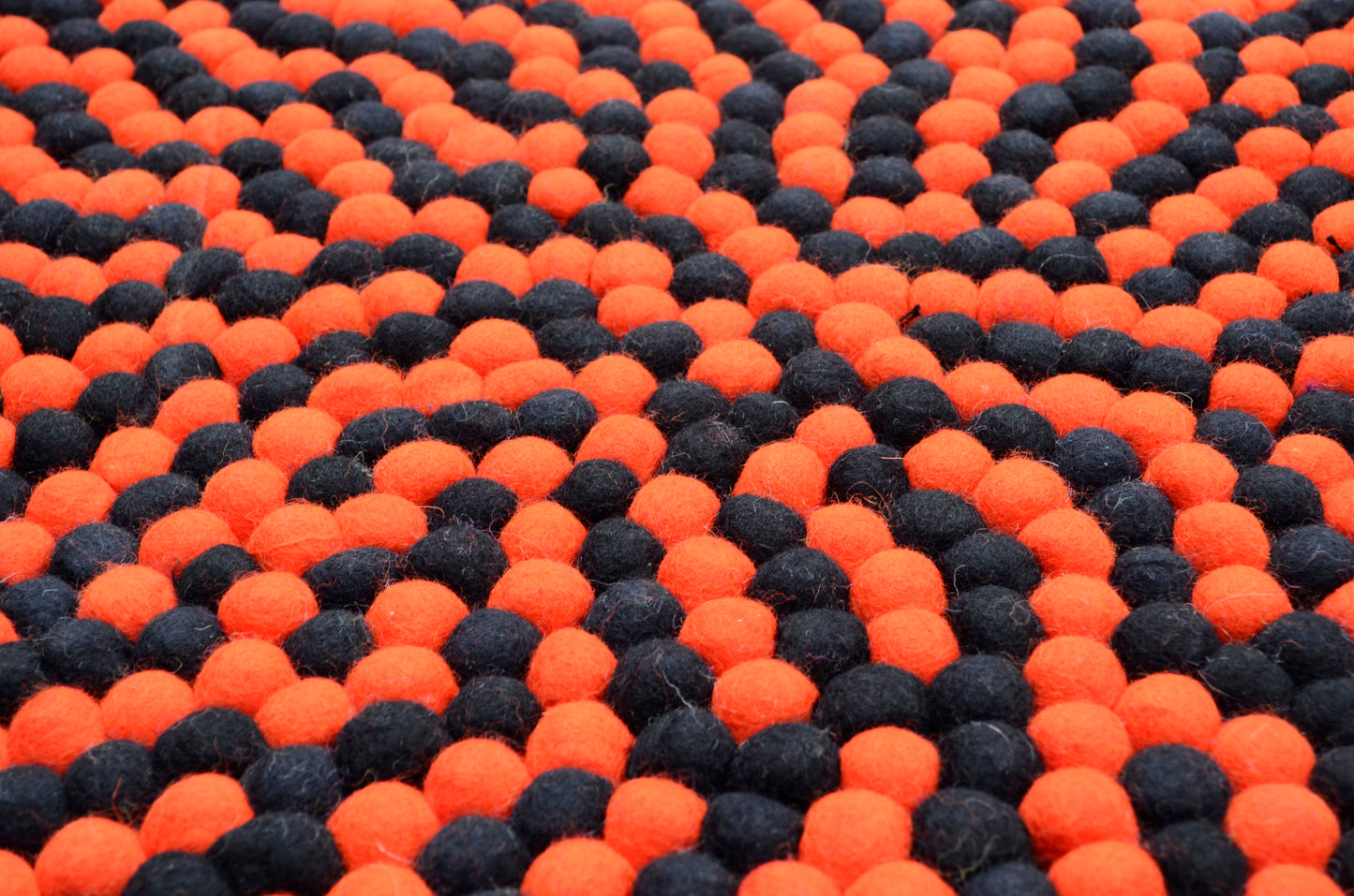 Round Black And Orange Wool Felt Ball Rug