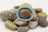 Light Blue Glass Beads Roll On Bracelet