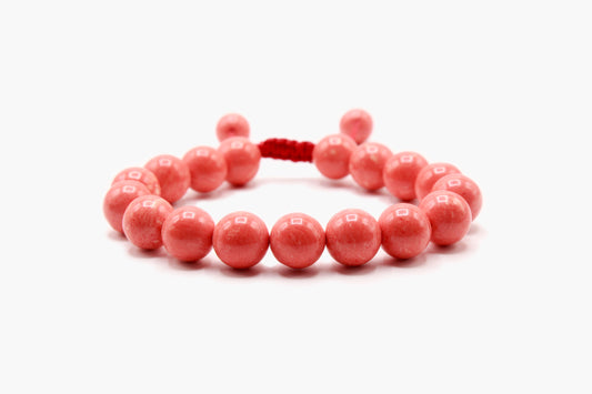Pink Coral 8 mm bead bracelet with round coral-pink beads, front view.