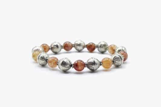 Red Jade bracelet with alternating silver-tone metal beads, front view.