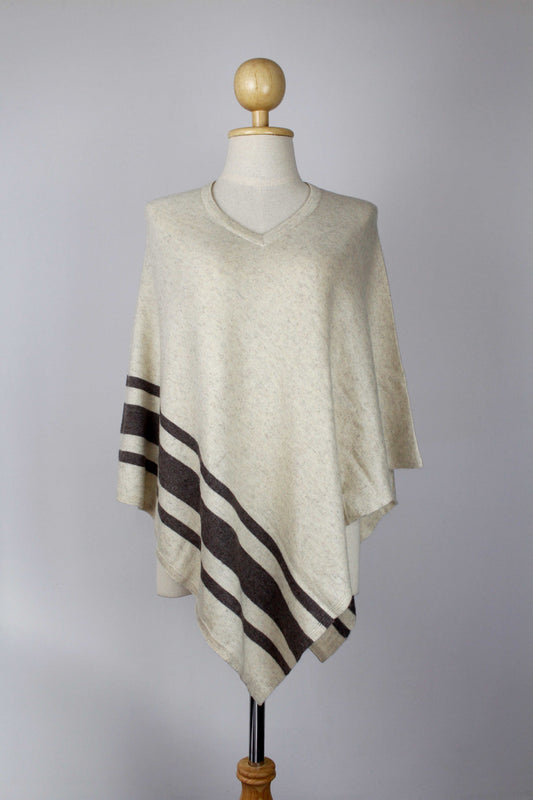Women's Cream cashmere V-neck poncho with Dark Brown stripe detailing, front view on a mannequin.