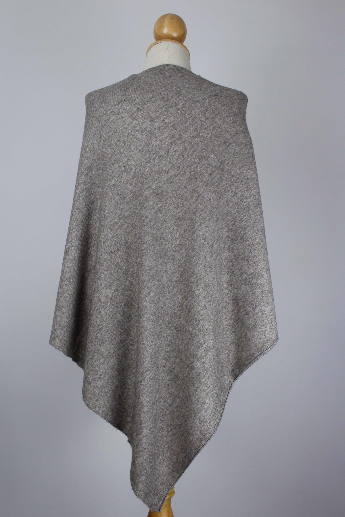 Women's Taupe Brown cashmere poncho displayed on a mannequin, back view showing the flowing silhouette.
