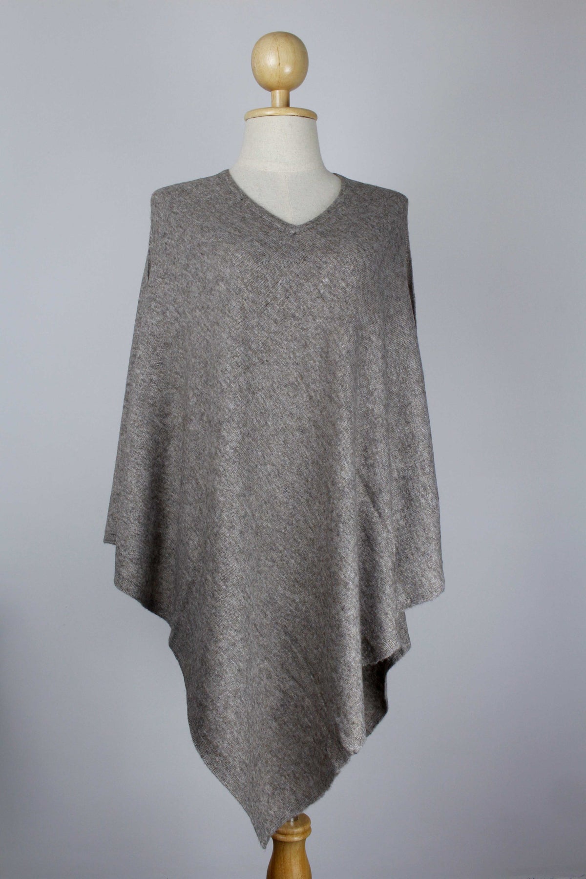 Women's Natural Taupe Brown cashmere V-neck poncho displayed on a mannequin, front view.