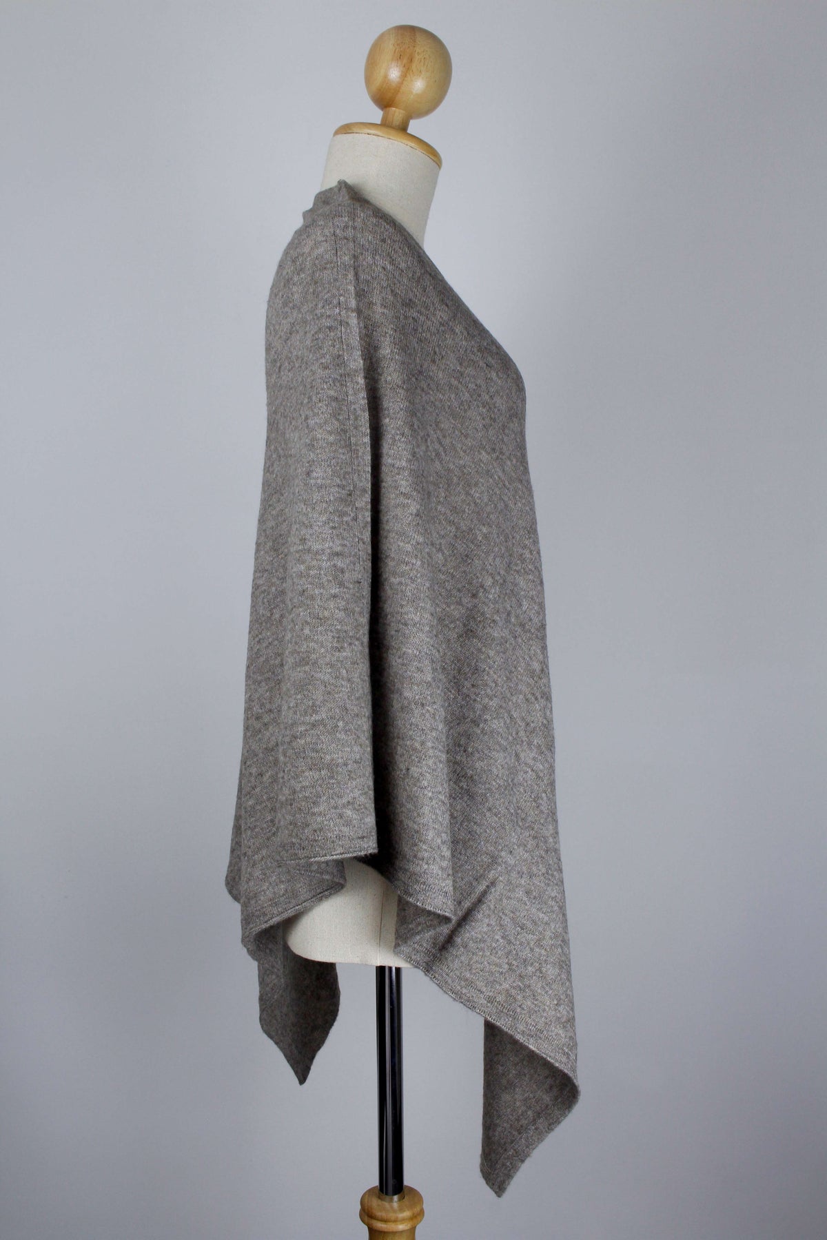 Women's Natural Taupe Brown cashmere poncho displayed on a mannequin, side view showing the relaxed drape.
