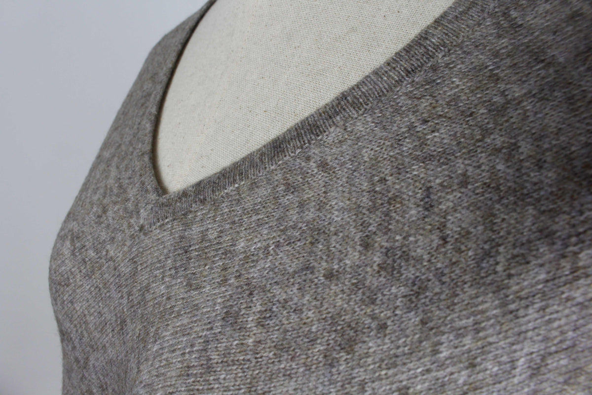 Close-up of the women's Taupe Brown cashmere poncho showing the V-neckline and fabric texture.