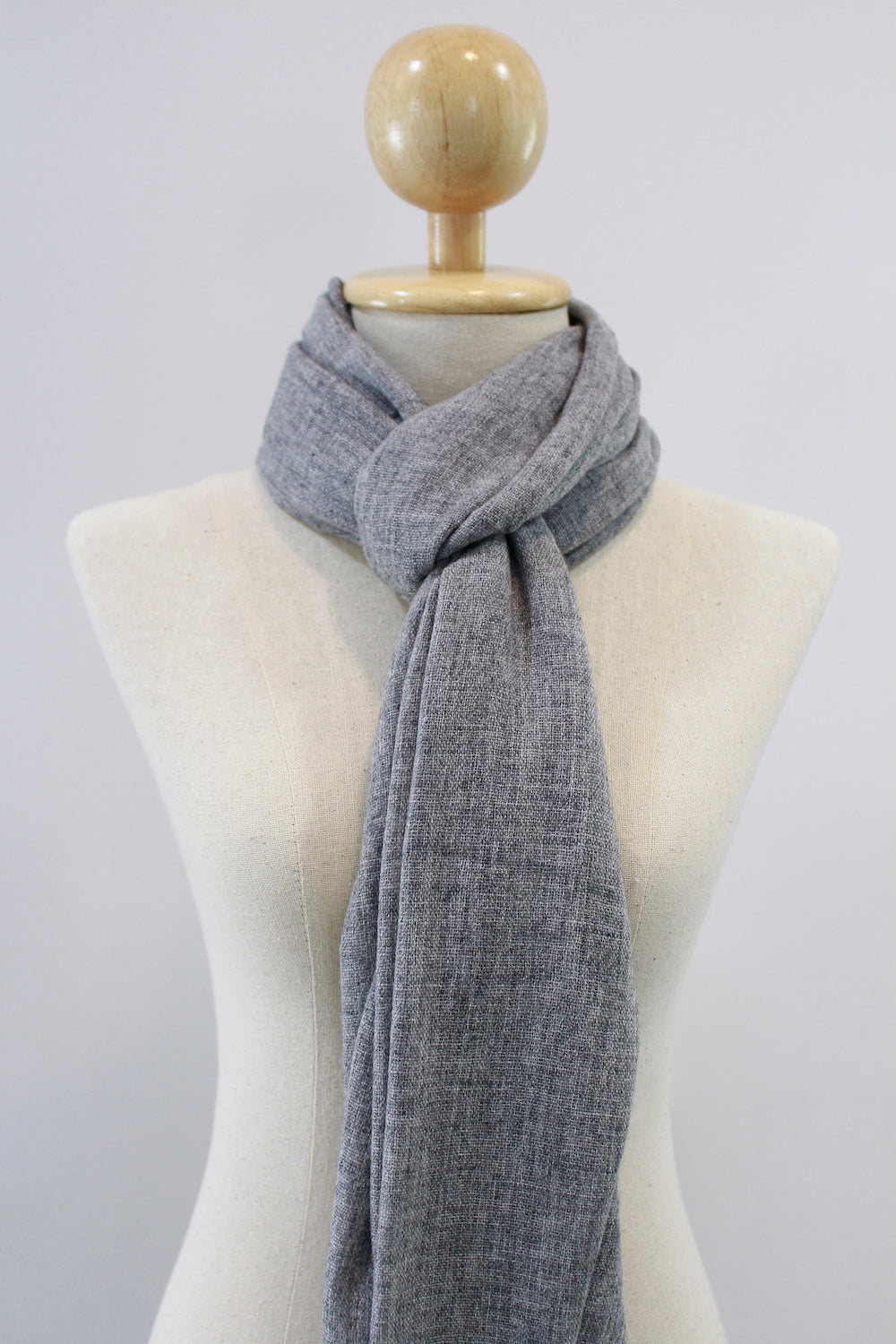 Ash Gray cashmere scarf loop styled on a mannequin.