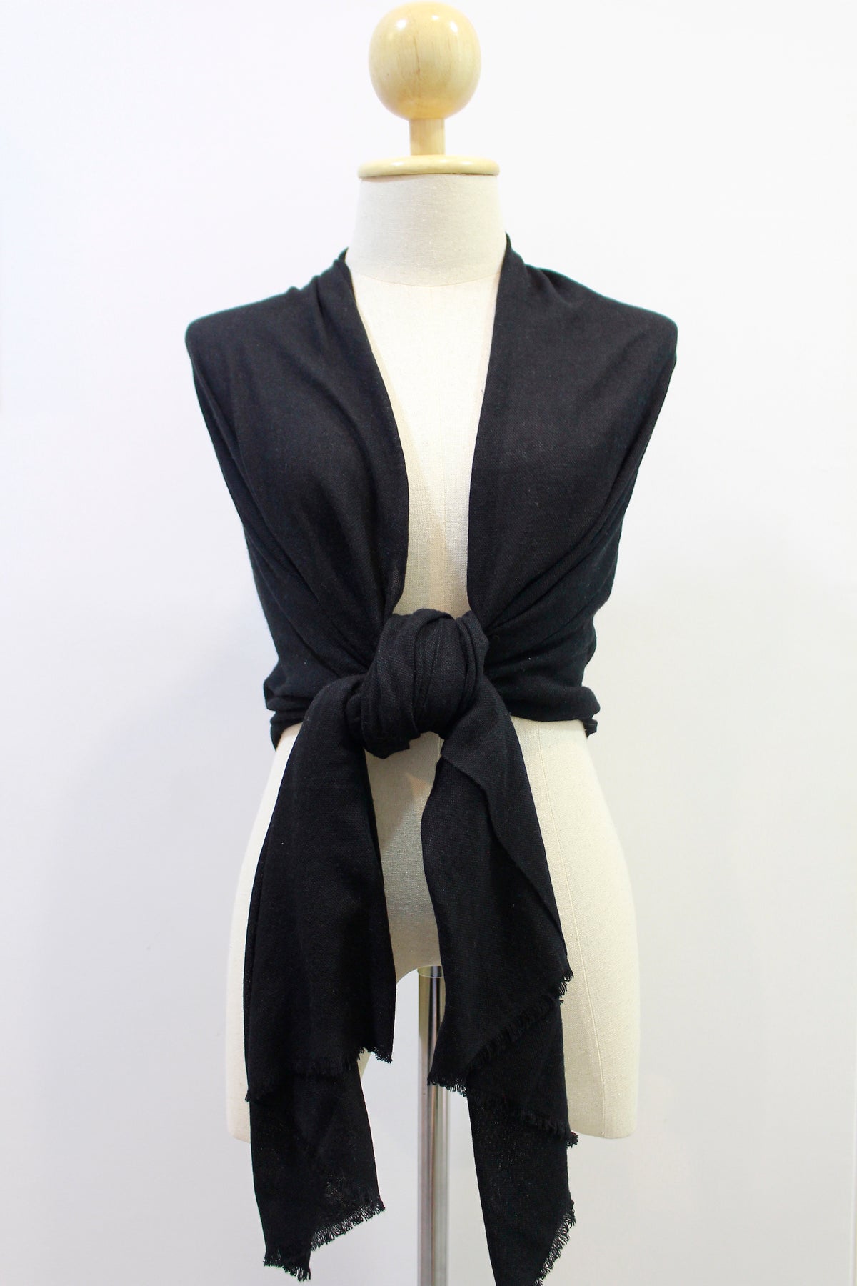 Classic Black cashmere scarf shoulder wrapped front-knot styled display on a mannequin.