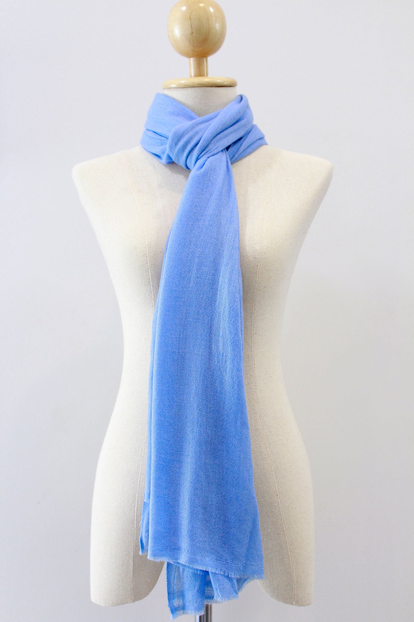 Sky Blue cashmere scarf loop style, displayed on a mannequin.