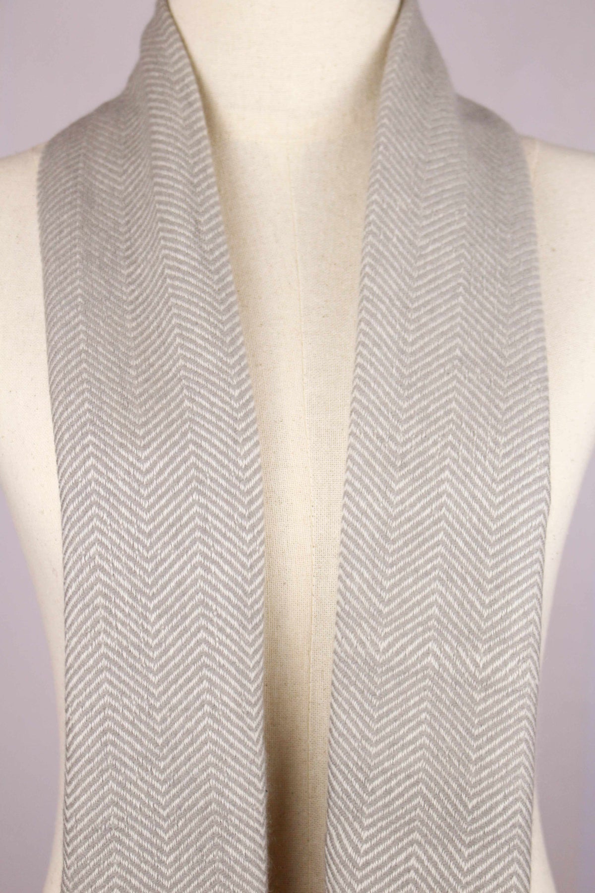Women's cashmere wool chevron warm gray scarf showing the twill weave and chevron pattern details